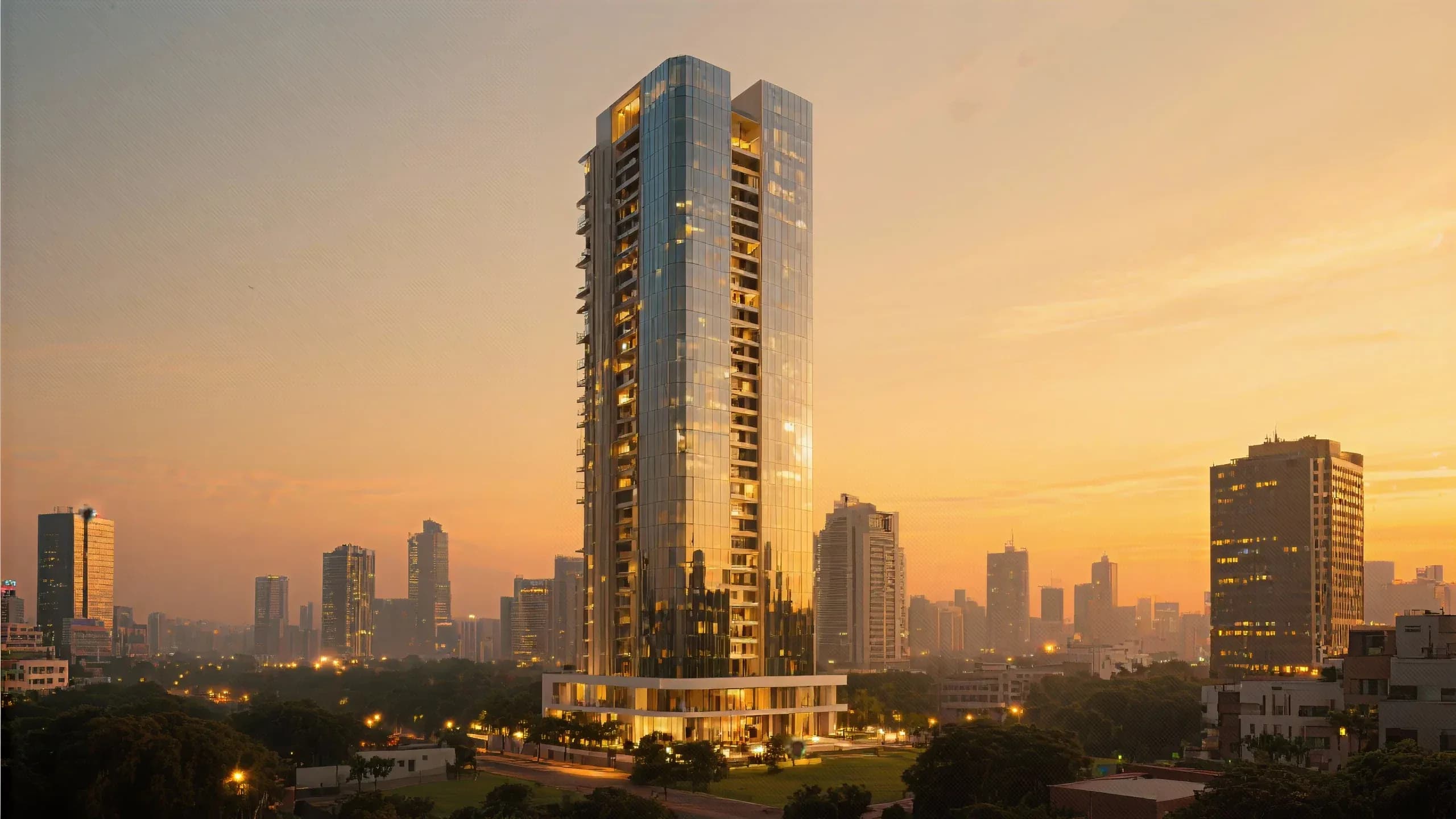 Glass residential tower rising over the city at sunset